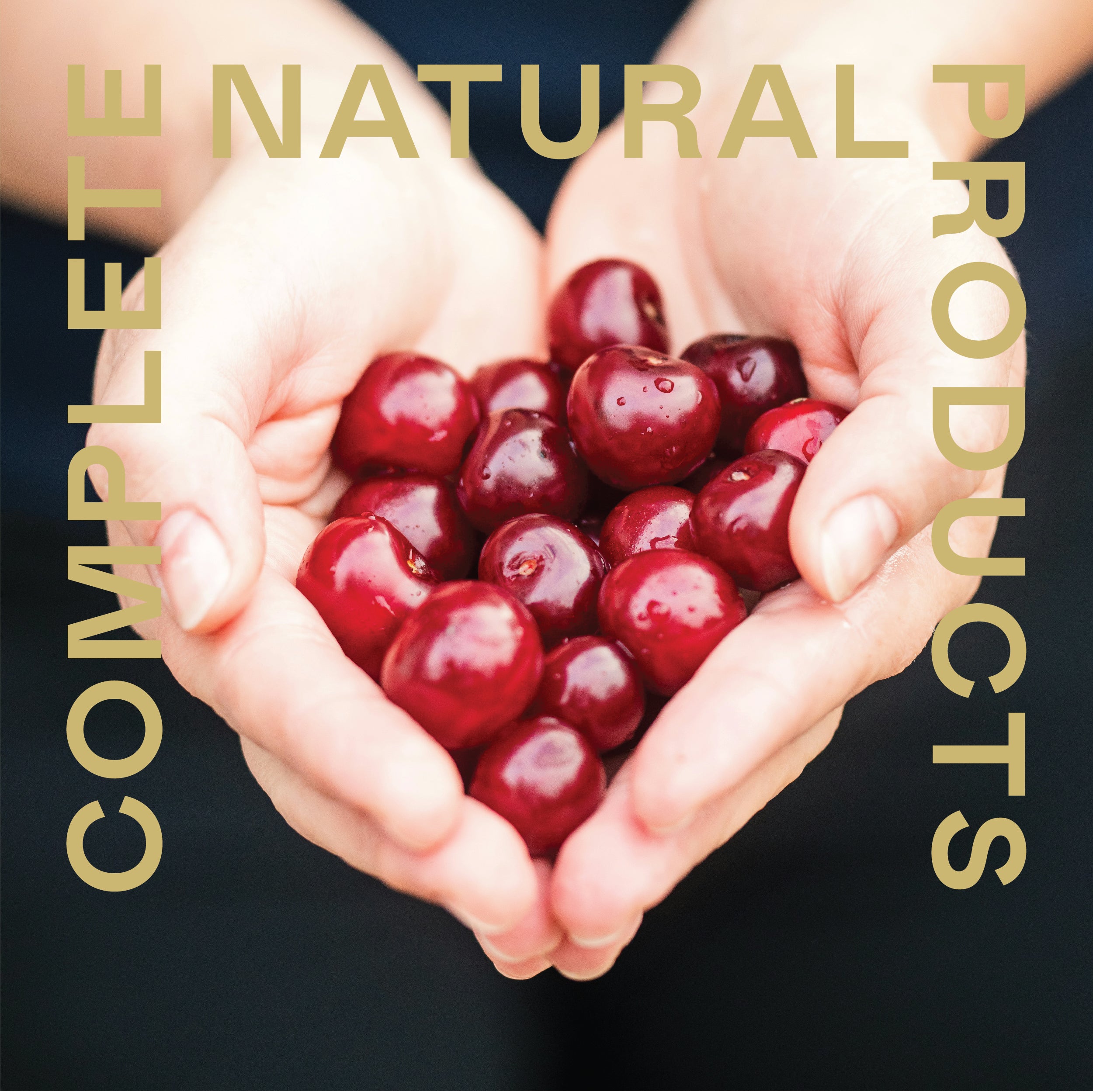 A pair of hands gently cups fresh organic red cherries. CNPUSA and Joint Support Complete - 16oz Glass Bottle are displayed in bold, tan letters, emphasizing joint support and wellness.