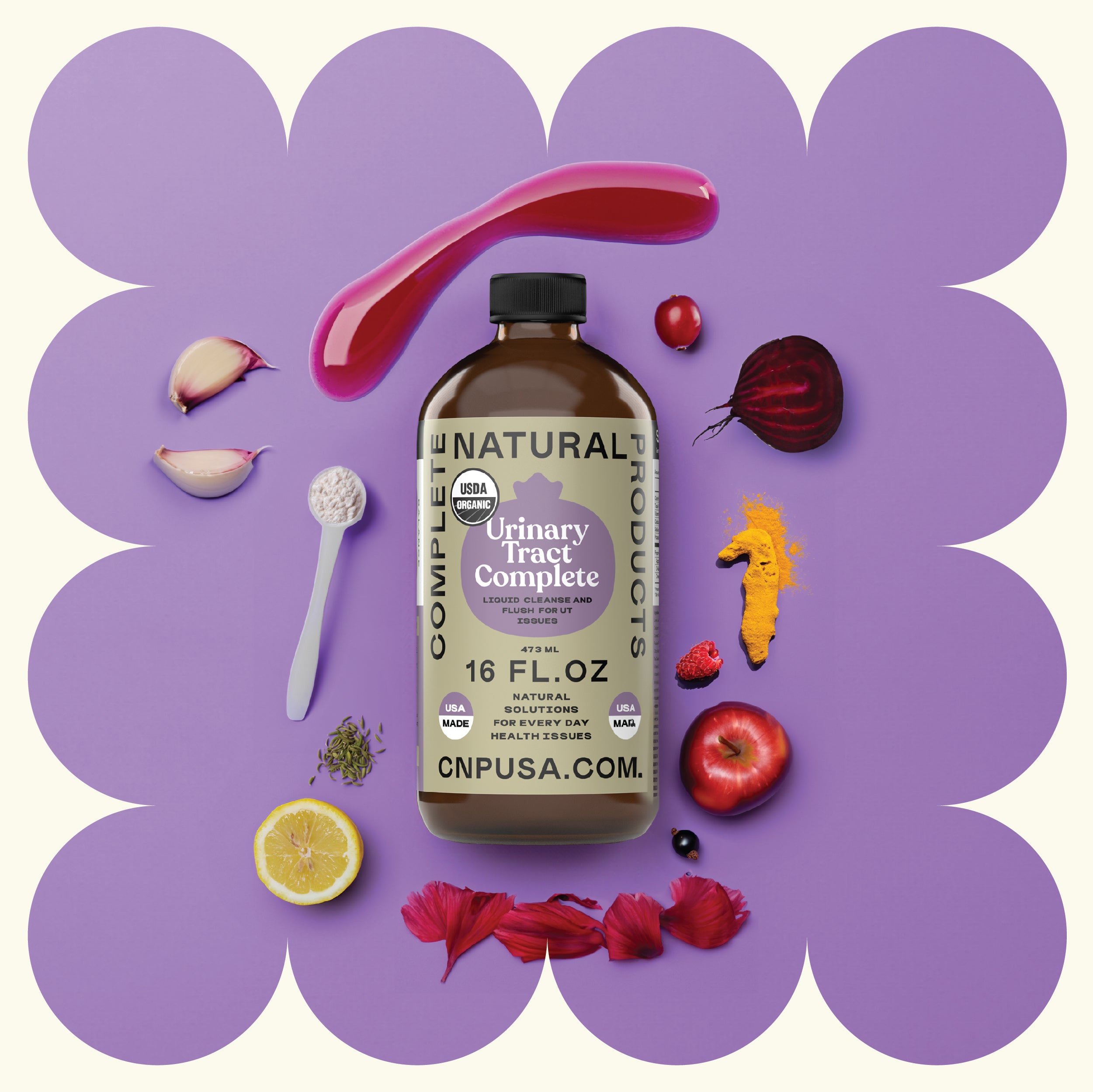 A CNPUSA Urinary Tract Complete - 16oz Glass Bottle rests on a purple background, surrounded by a spoon, root vegetables, berries, lemon slice, flower petals, and a dollop of pink liquid cleanse with scalloped edges framing the scene.